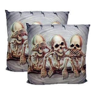 2 throw pillows with "see no evil, hear no evil, speak no evil" skeleton design